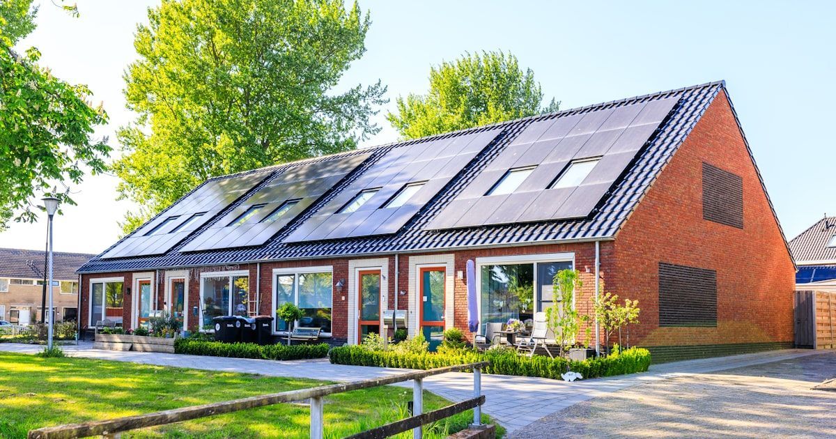 A house with rooftop solar panels installed.